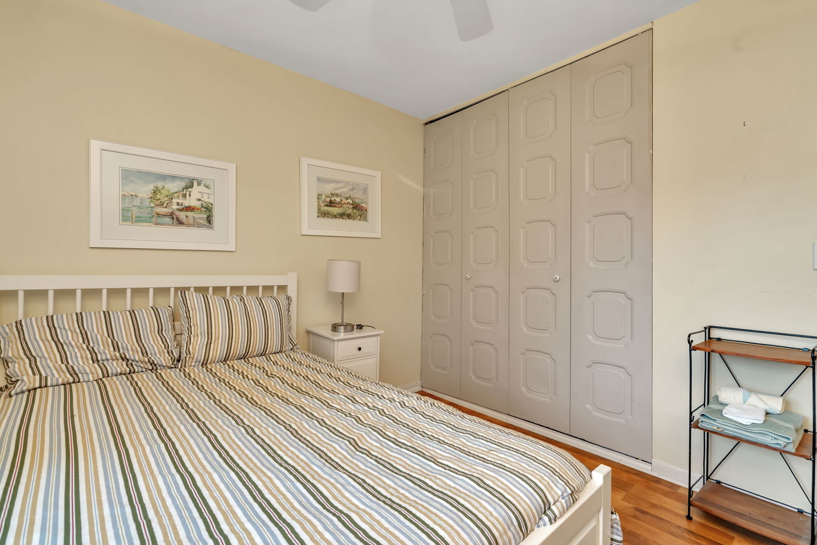 522 Julie Road Bolingbrook, IL 60440 - Photo 16 of 28 a bedroom with a bed and wooden floor