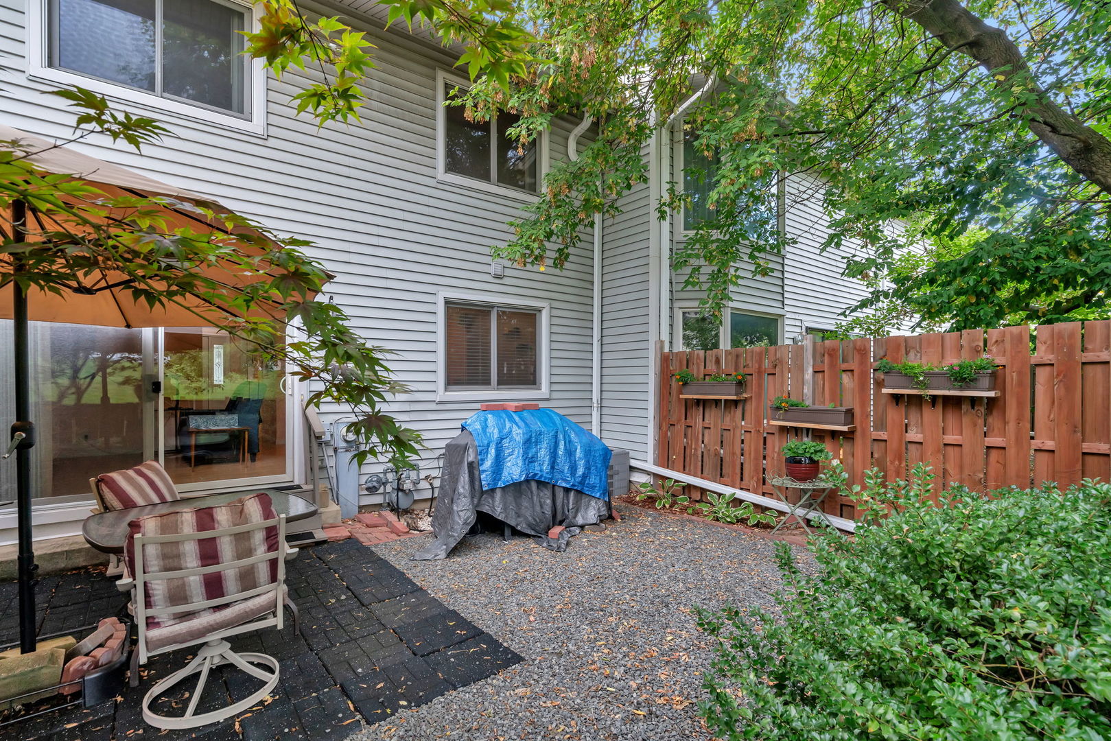 522 Julie Road Bolingbrook, IL 60440 - Photo 25 of 28 a backyard of a house with barbeque oven and fence