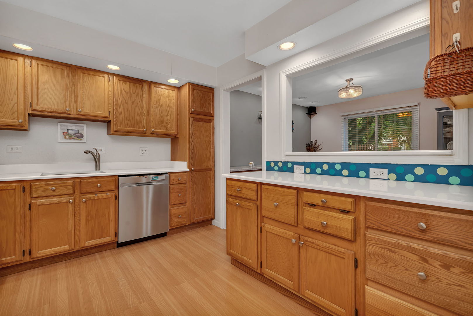 522 Julie Road Bolingbrook, IL 60440 - Photo 8 of 28 a kitchen with wooden cabinets and white appliances