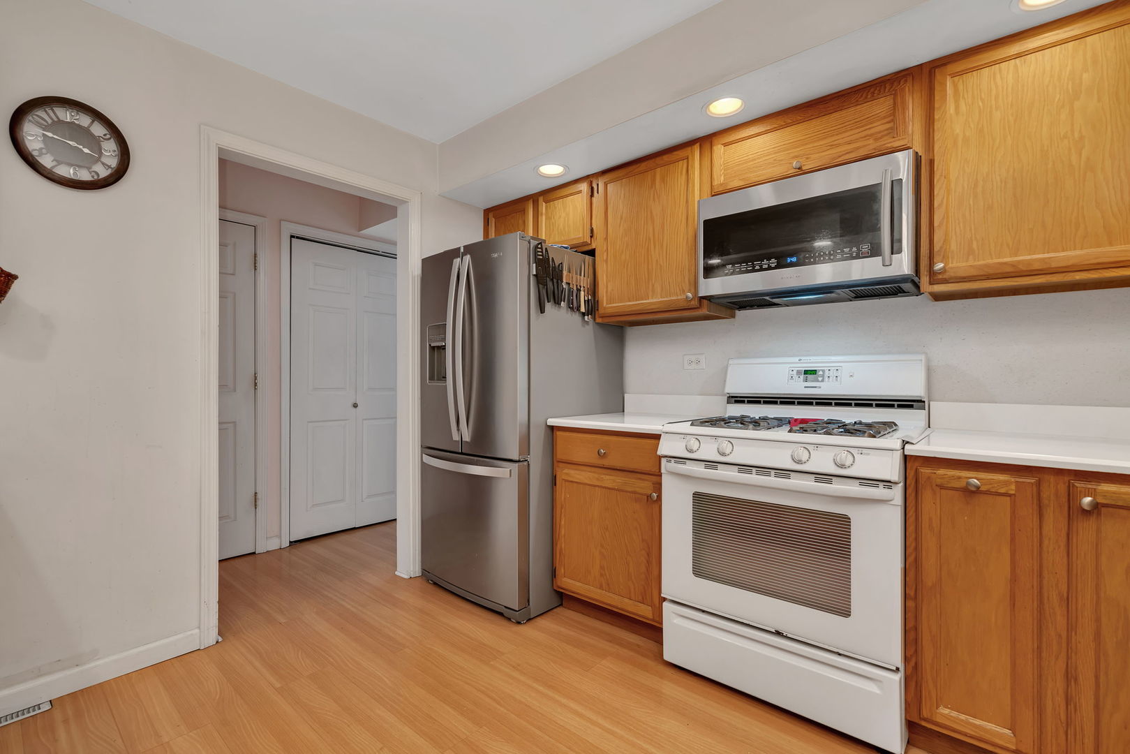522 Julie Road Bolingbrook, IL 60440 - Photo 9 of 28 a kitchen with stainless steel appliances granite countertop a stove microwave and refrigerator