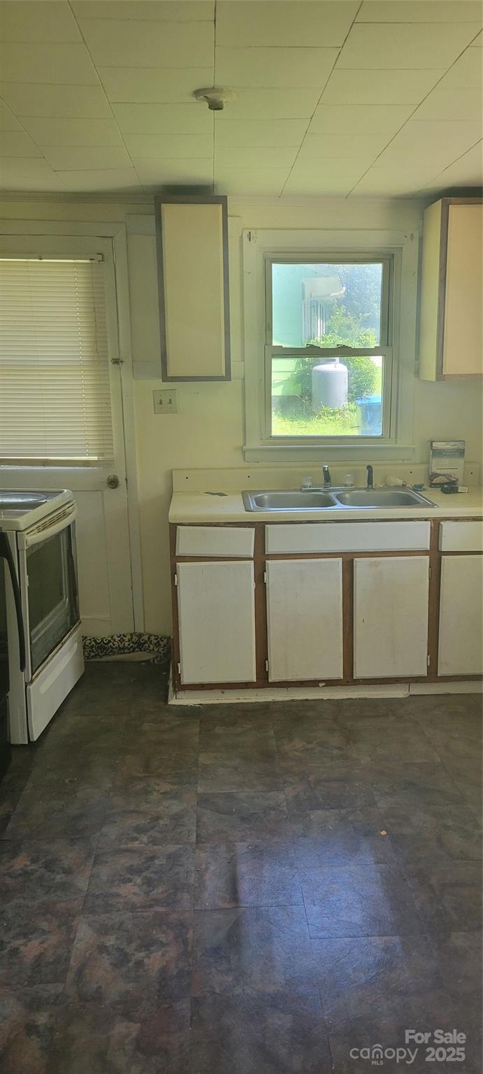 335 Rosenwald School Street Catawba, NC 28609 - Photo 7 of 13 a view of a kitchen with a sink cabinets and a window