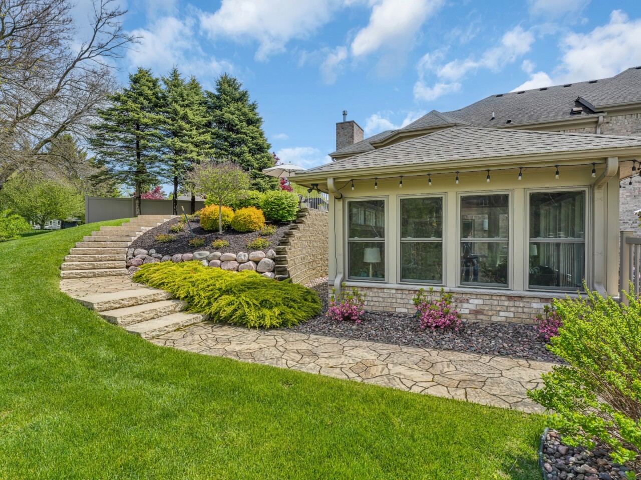 8 Lake Pointe Circle Wind Point, WI 53402 - Photo 25 of 32 path to lower level patio