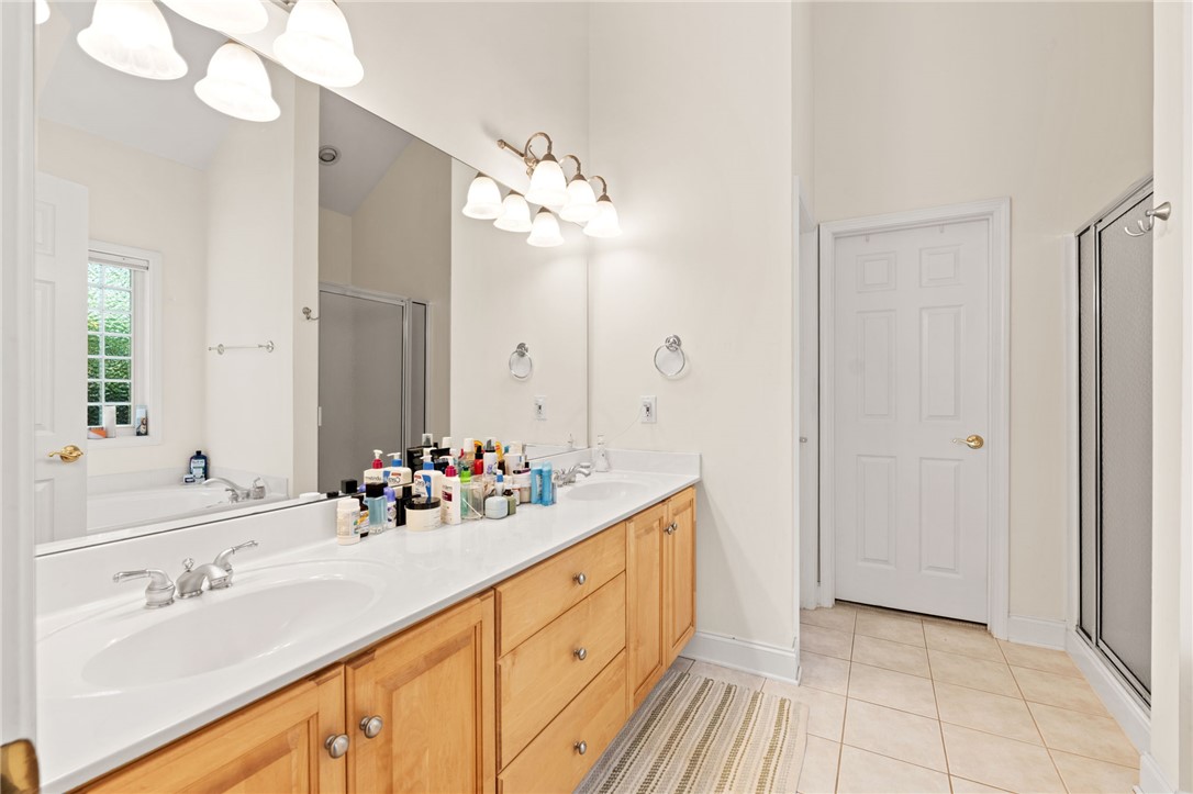 108 Winterbrook Circle Seneca, SC 29678 - Photo 23 of 40 Double vanity and spacious mirror create a functional and well-lit primary bathroom.