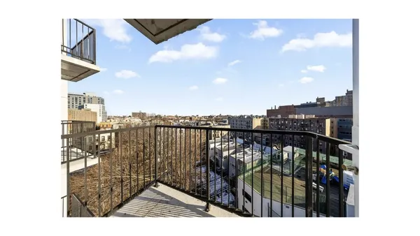 a balcony with wooden floor
