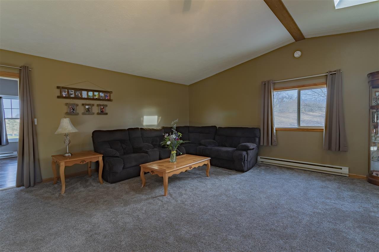 9119 Montague Road Winnebago, IL 61088 - Photo 15 of 36 a living room with furniture and a window
