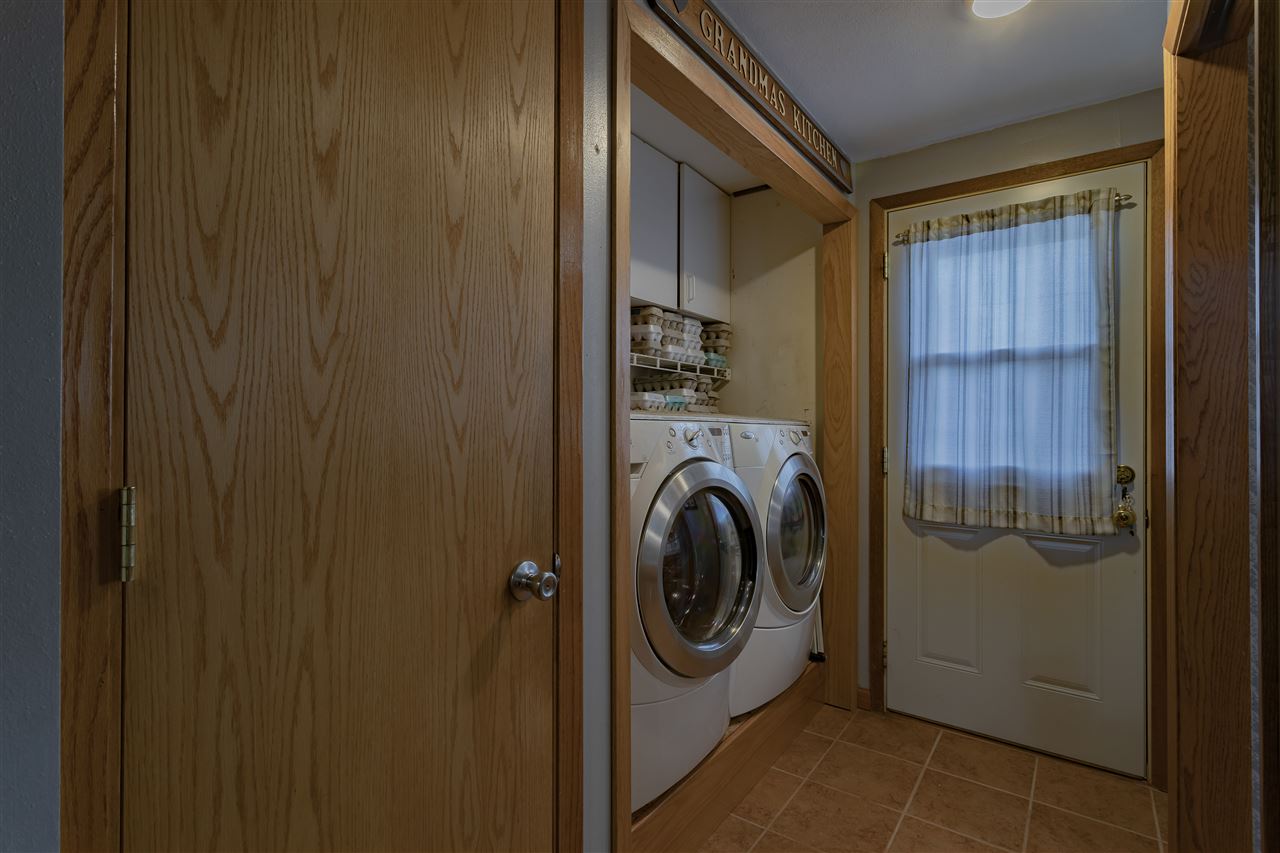 9119 Montague Road Winnebago, IL 61088 - Photo 17 of 36 a utility room with dryer and washer