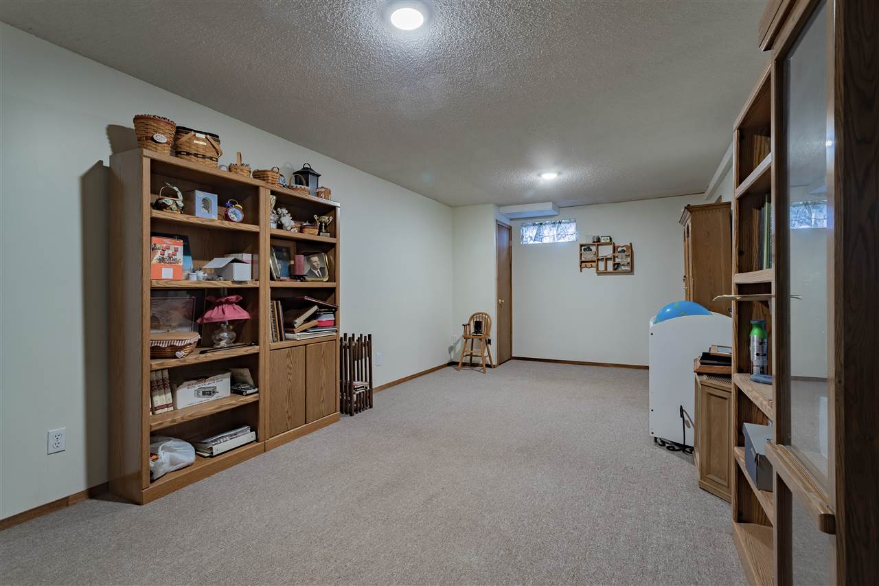 9119 Montague Road Winnebago, IL 61088 - Photo 23 of 36 a view of room with window and shelf