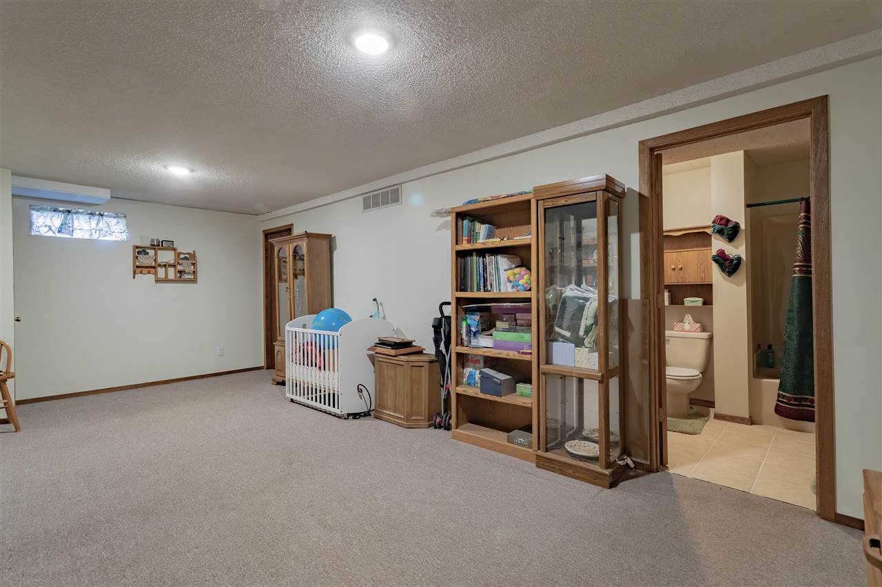 9119 Montague Road Winnebago, IL 61088 - Photo 24 of 36 a room with furniture and white walls