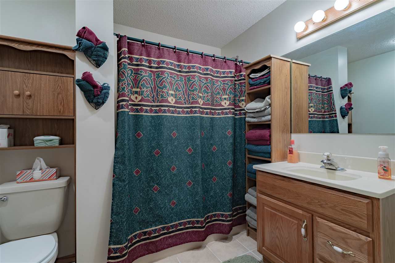 9119 Montague Road Winnebago, IL 61088 - Photo 25 of 36 a bathroom with a sink and a mirror
