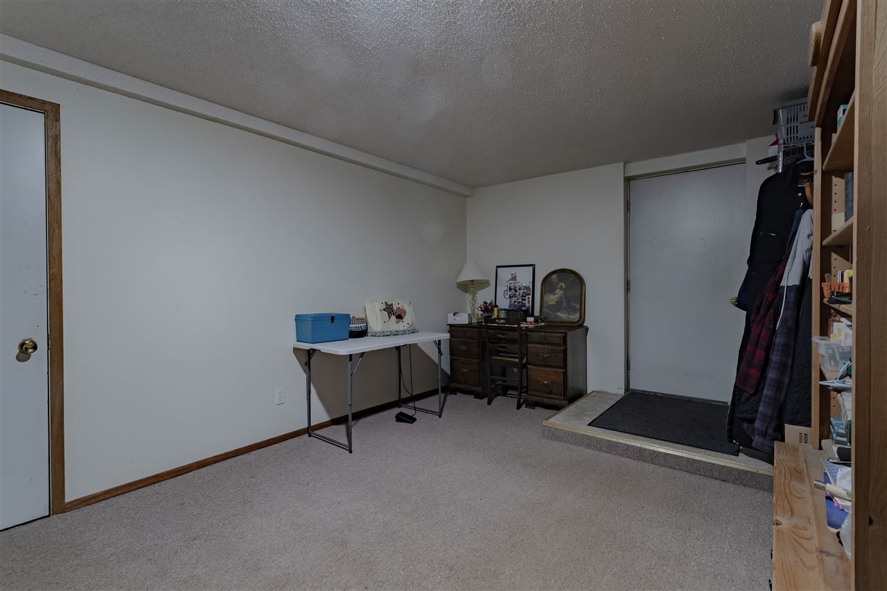 9119 Montague Road Winnebago, IL 61088 - Photo 26 of 36 a room with furniture and a window