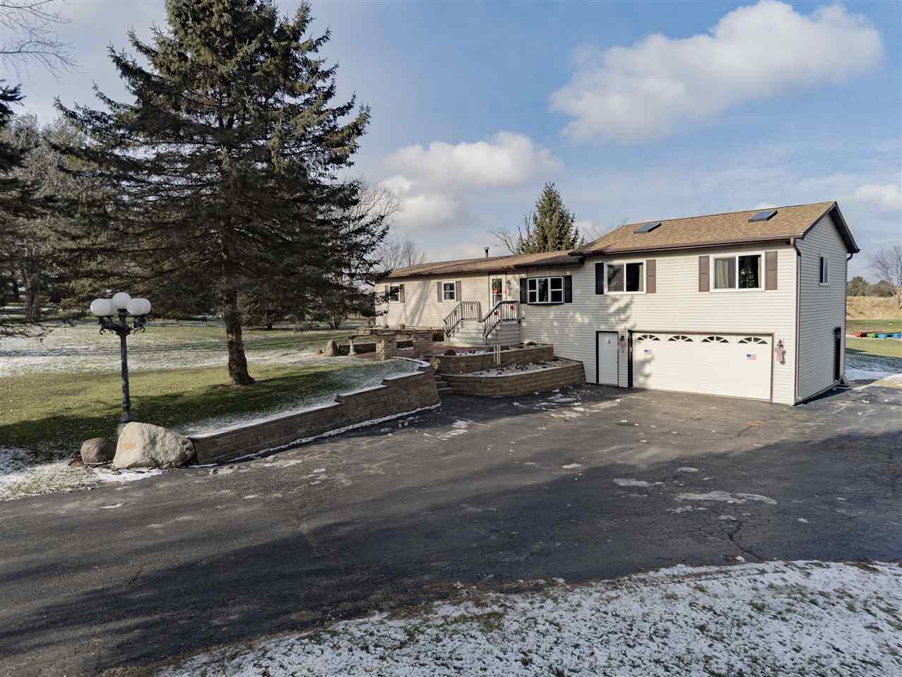 9119 Montague Road Winnebago, IL 61088 - Photo 27 of 36 a view of a street with houses
