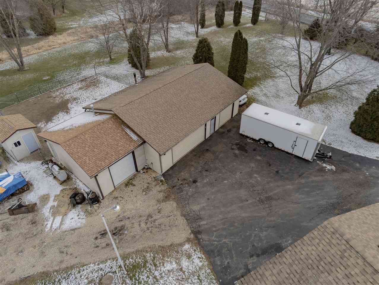 9119 Montague Road Winnebago, IL 61088 - Photo 30 of 36 a view of backyard with outdoor seating