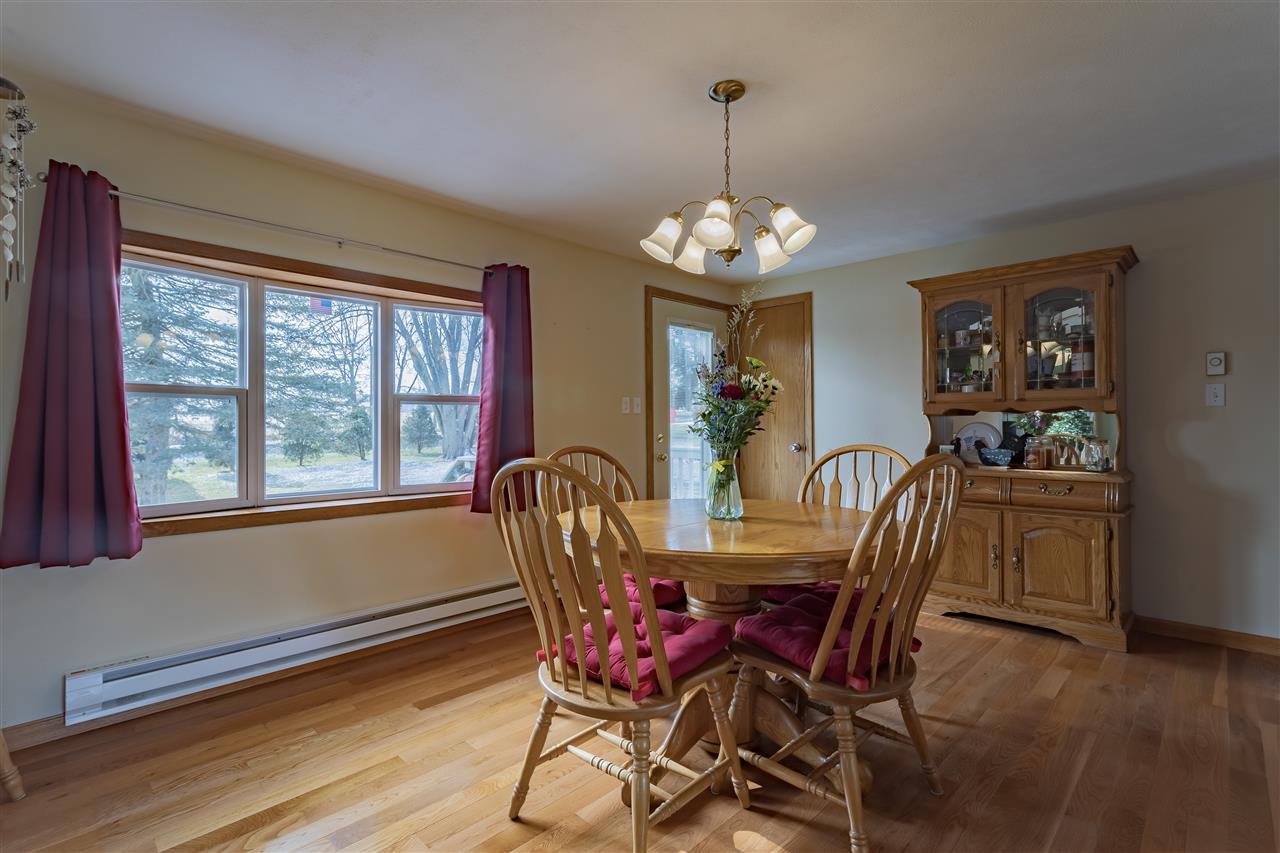 9119 Montague Road Winnebago, IL 61088 - Photo 4 of 36 a view of a dining room with furniture window and wooden floor