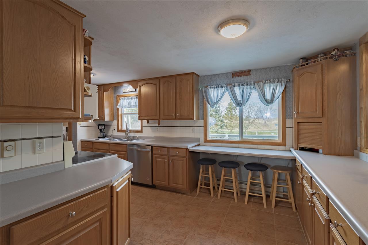 9119 Montague Road Winnebago, IL 61088 - Photo 7 of 36 a kitchen with a sink and cabinets