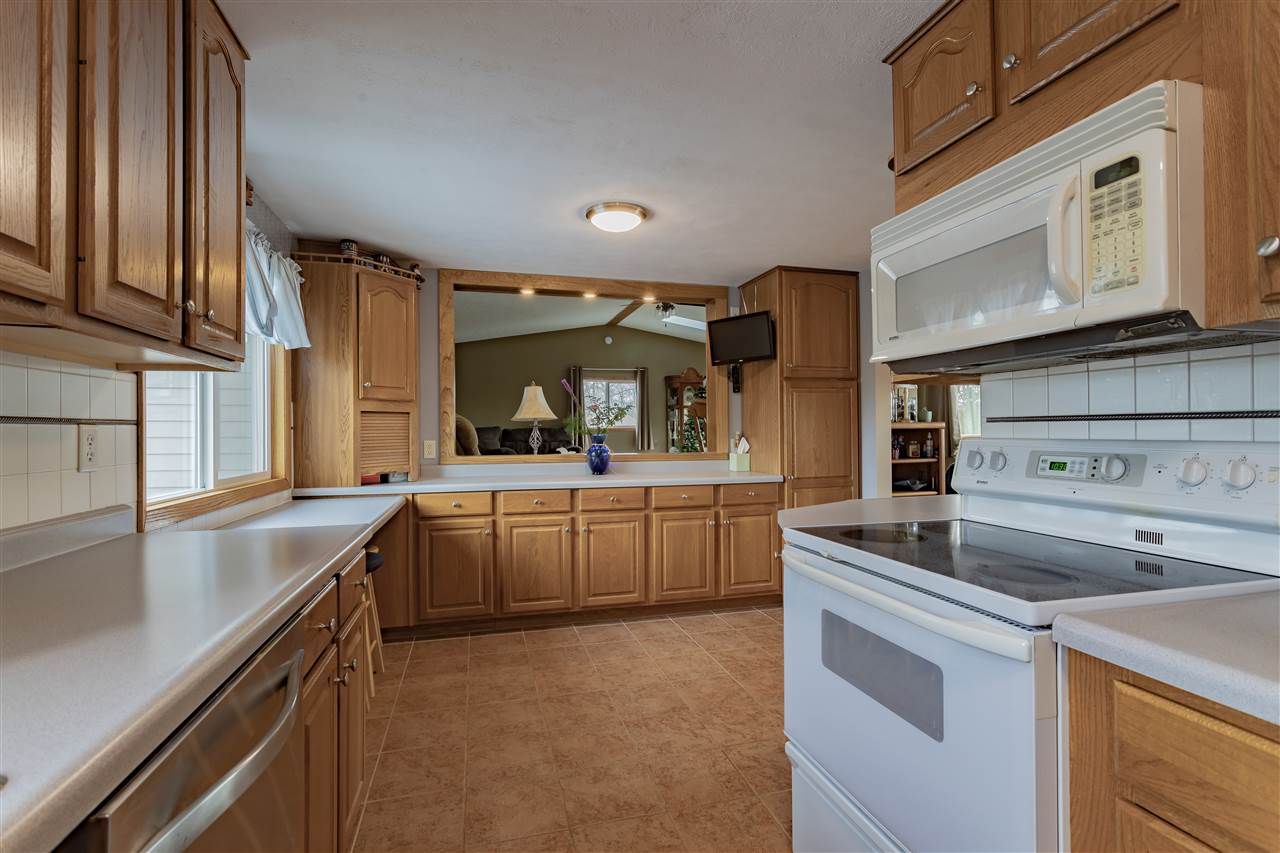 9119 Montague Road Winnebago, IL 61088 - Photo 10 of 36 a kitchen that has a sink and a stove