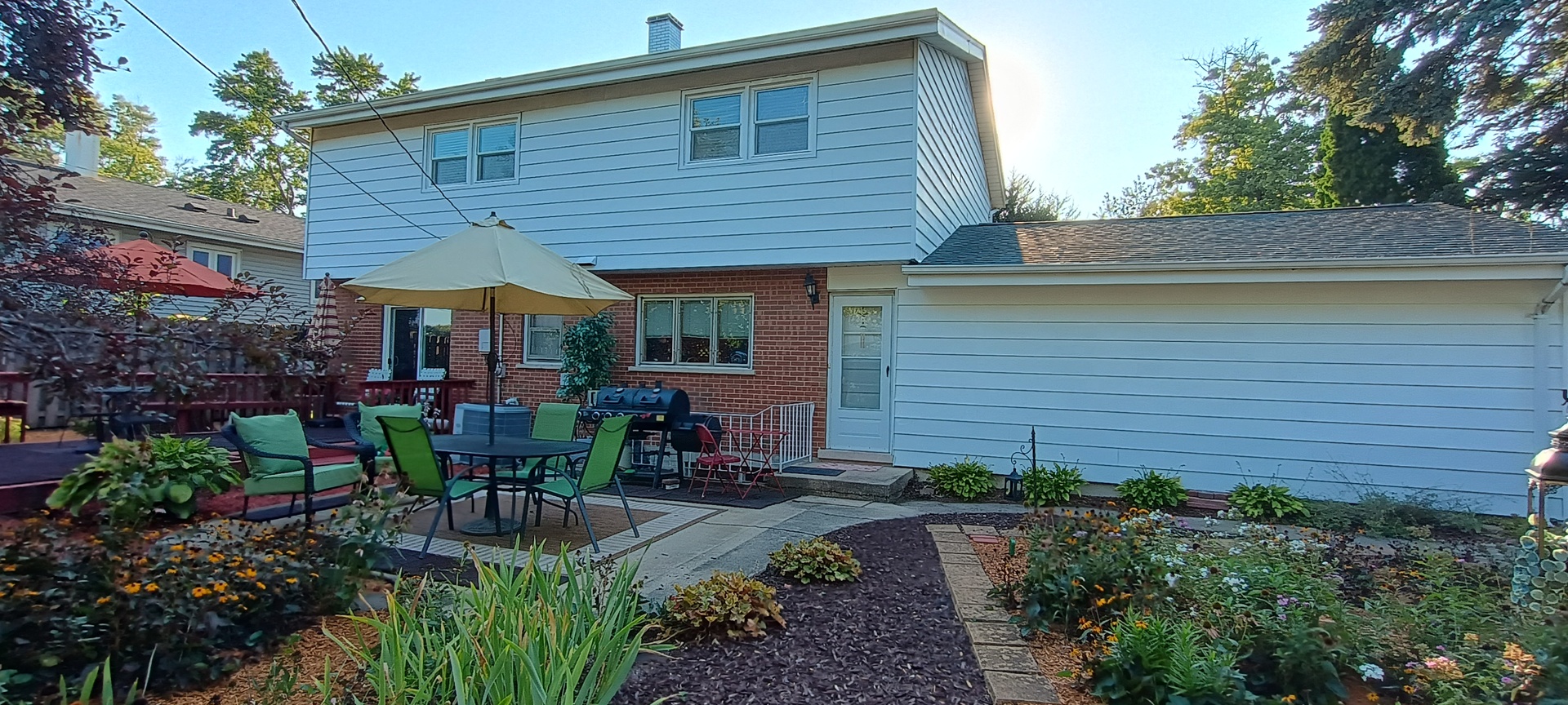 18751 Kings Road Homewood, IL 60430 - Photo 34 of 35 a view of a house with sitting area and potted plants
