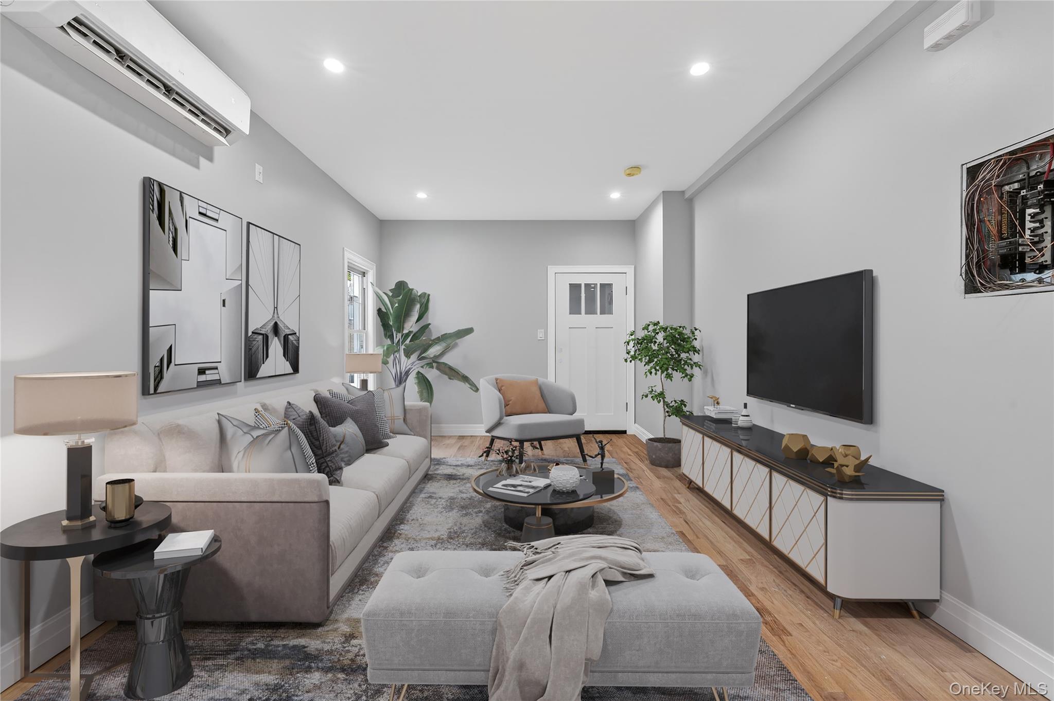 a living room with furniture and a flat screen tv