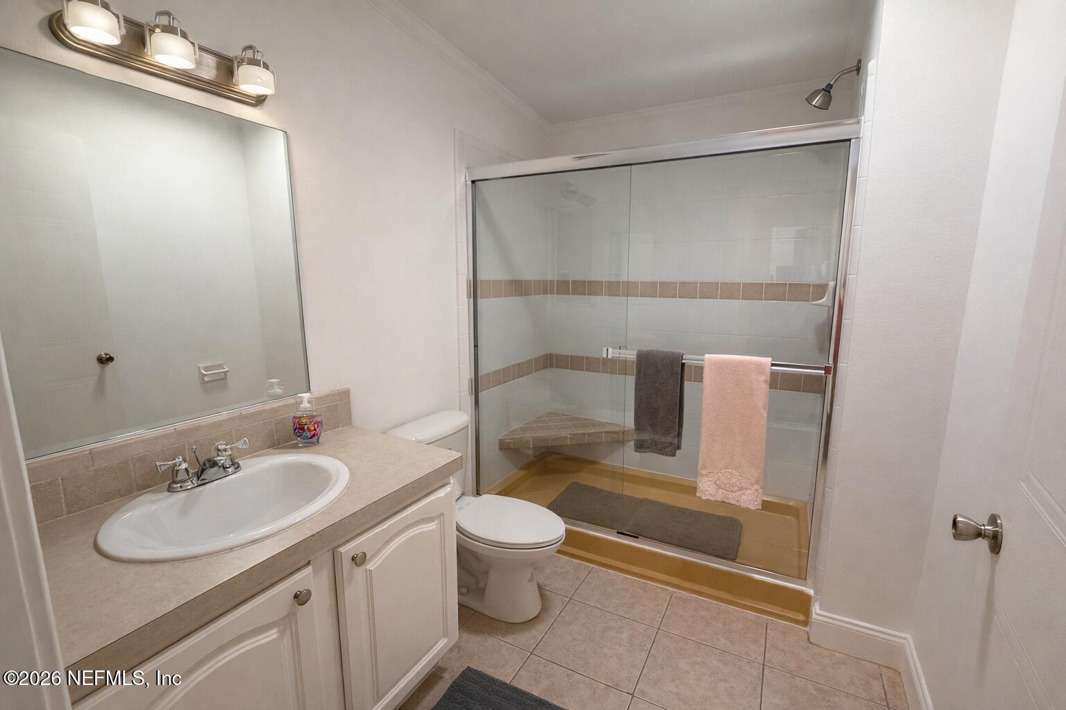 2490 Violet Way Middleburg, FL 32068 - Photo 25 of 64 a bathroom with a sink toilet and shower
