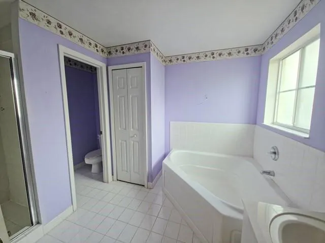 a view of a hallway with closet area