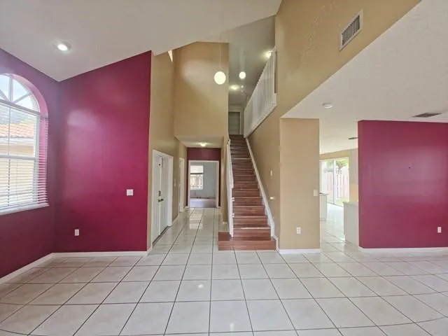 a view of entryway and hall with a window