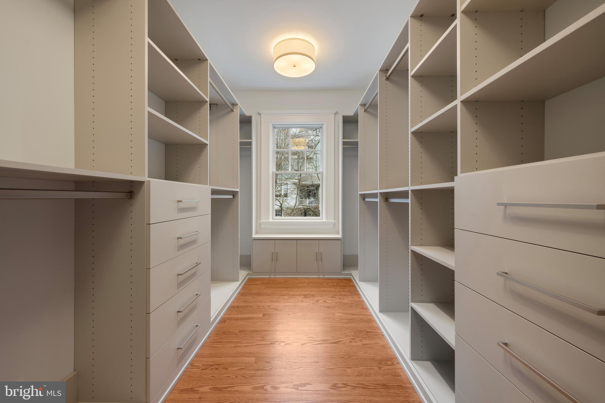 520 Woodlawn Road Baltimore, MD 21210 - Photo 20 of 39 a hallway with cabinets and wooden floor