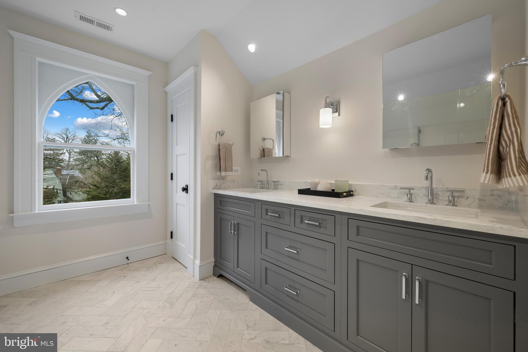 520 Woodlawn Road Baltimore, MD 21210 - Photo 27 of 39 a spacious bathroom with a granite countertop sink mirror and window