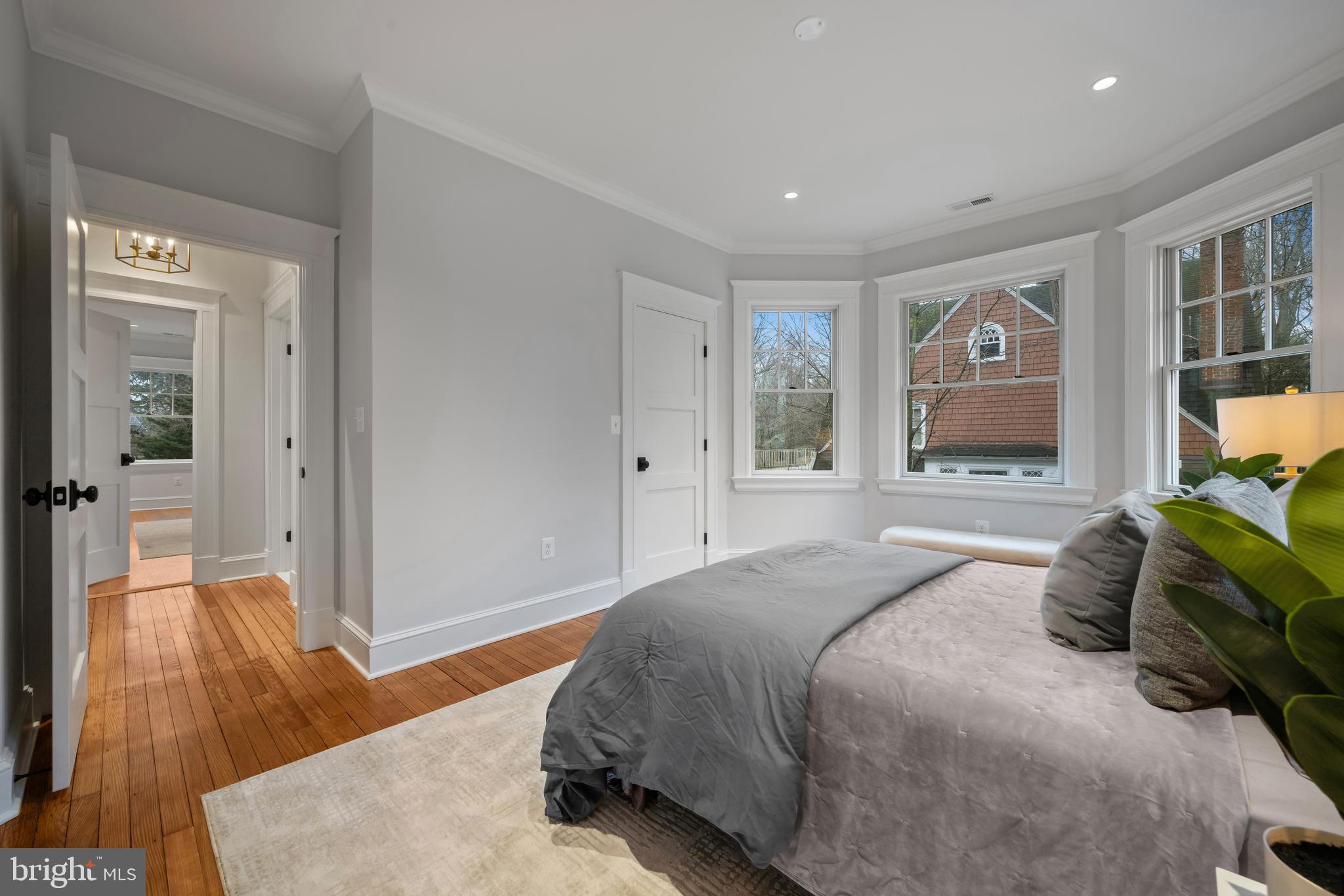 520 Woodlawn Road Baltimore, MD 21210 - Photo 30 of 39 a bedroom with a bed and wooden floor