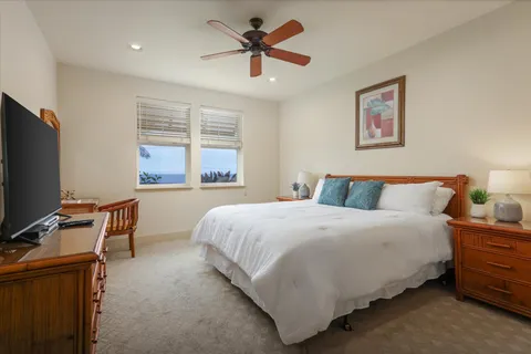 a bedroom with bed and window