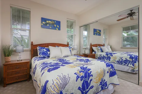 a bedroom with bed and windows