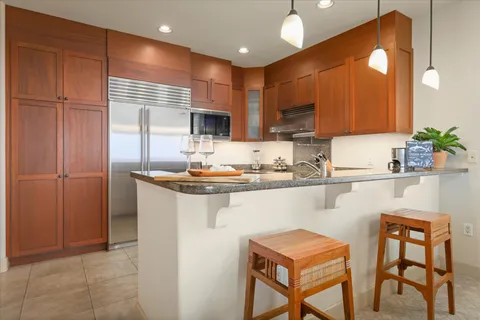 a kitchen with a sink cabinets and appliances