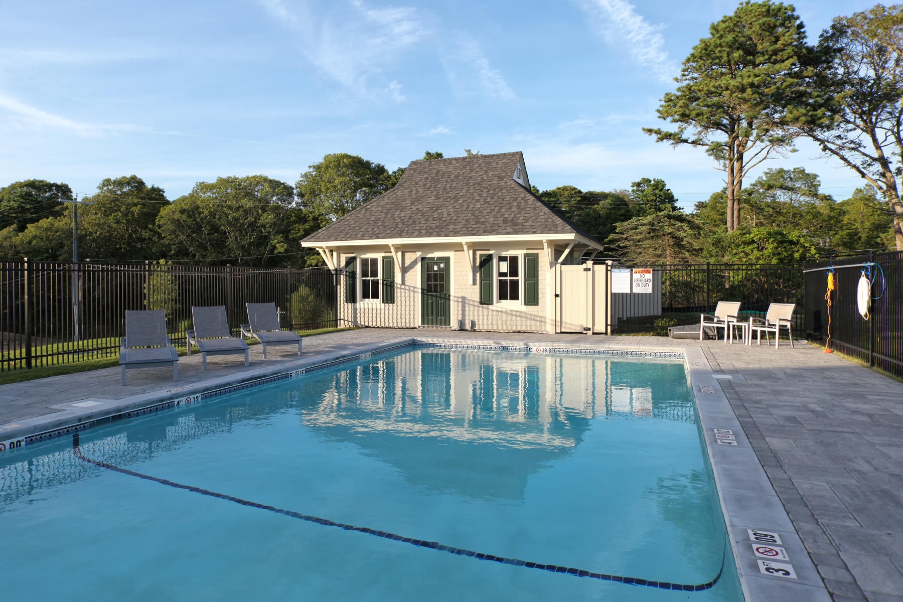 1090 Shore Road, Unit 10 Pocasset, MA 02559 - Photo 29 of 29 a front view of a house with garden