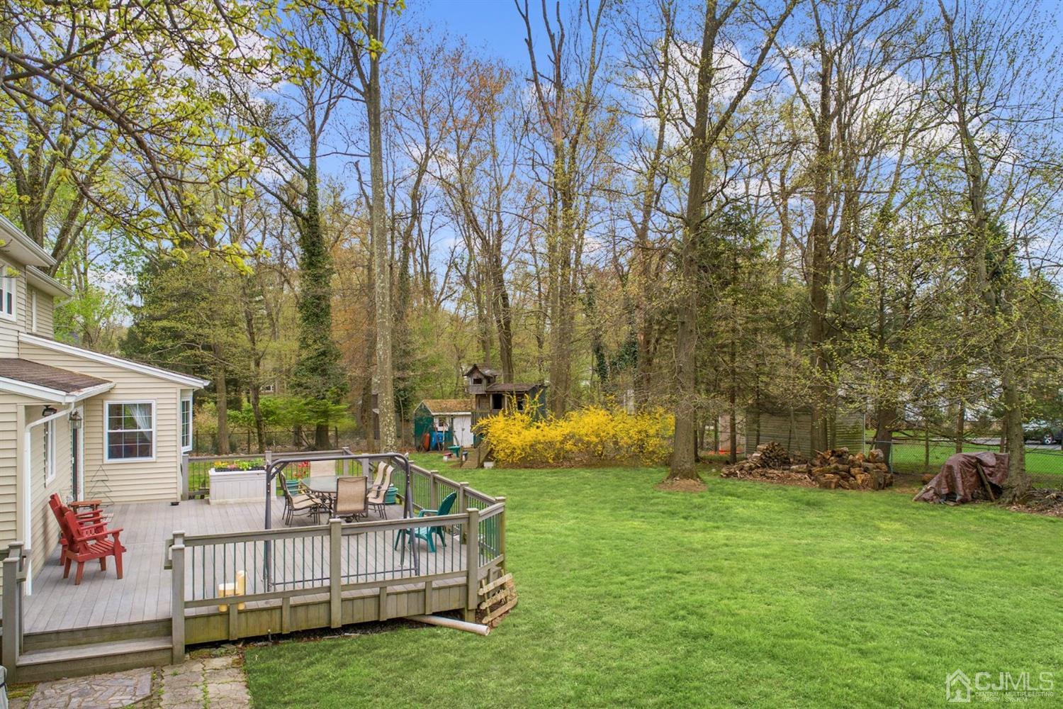 7 Chandler Road Edison, NJ 08820 - Photo 3 of 17 a view of backyard with a garden and trees