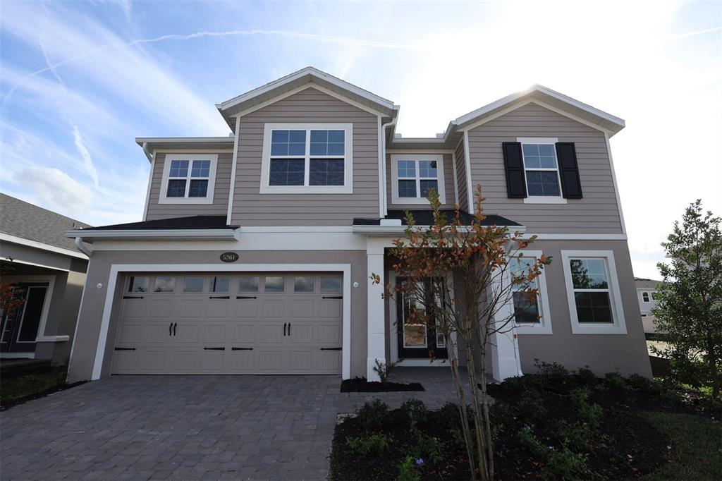5261 High Line Drive St. Cloud, FL 34771 - Photo 1 of 39 a front view of a house with a yard