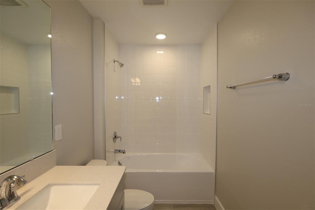 5261 High Line Drive St. Cloud, FL 34771 - Photo 26 of 39 a bathroom with a sink toilet and shower