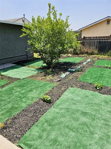 a backyard of a house with lots of green space