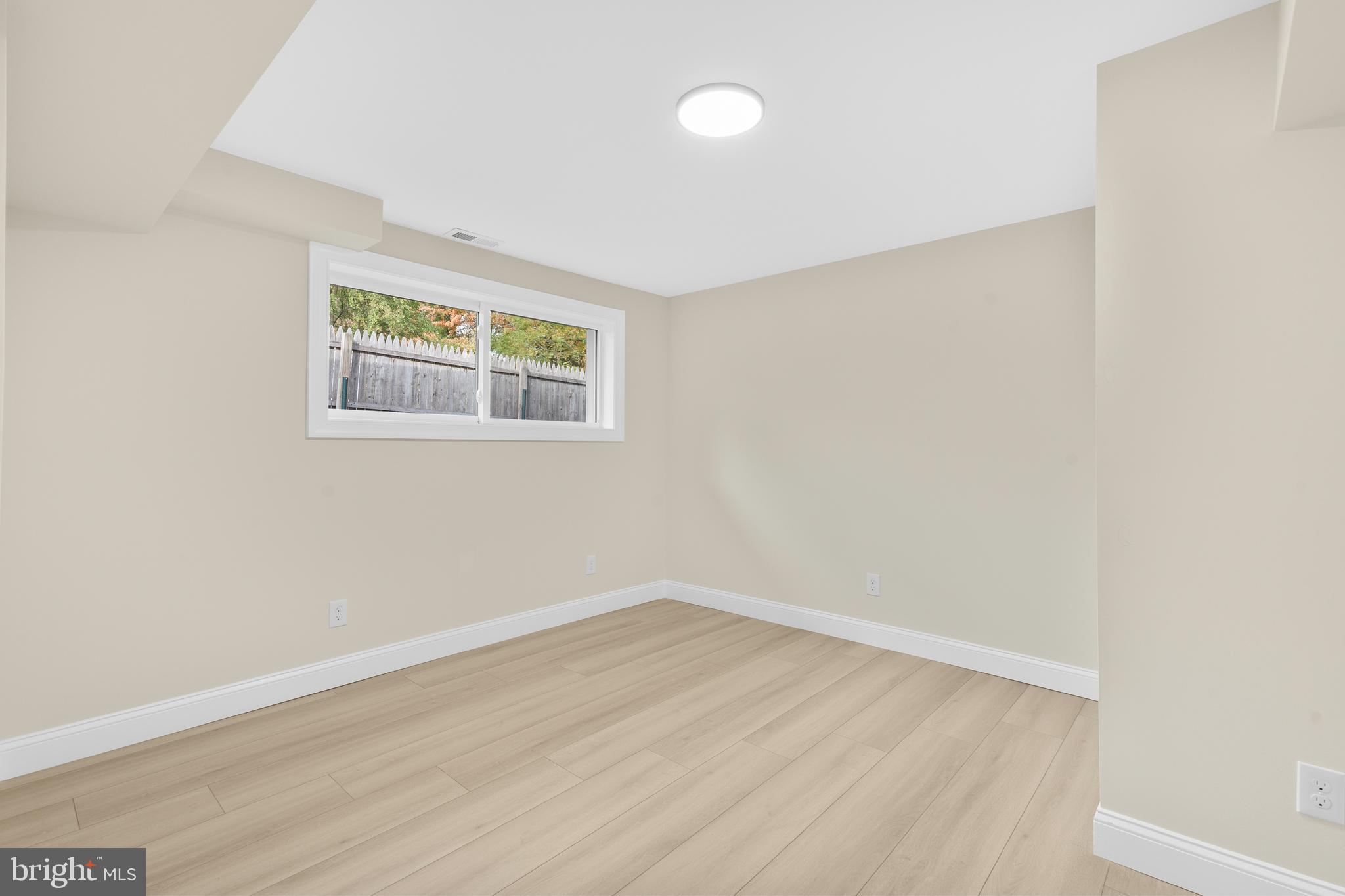 120 Canterbury Road Mount Laurel, NJ 08054 - Photo 19 of 46 an empty room with wooden floor and windows