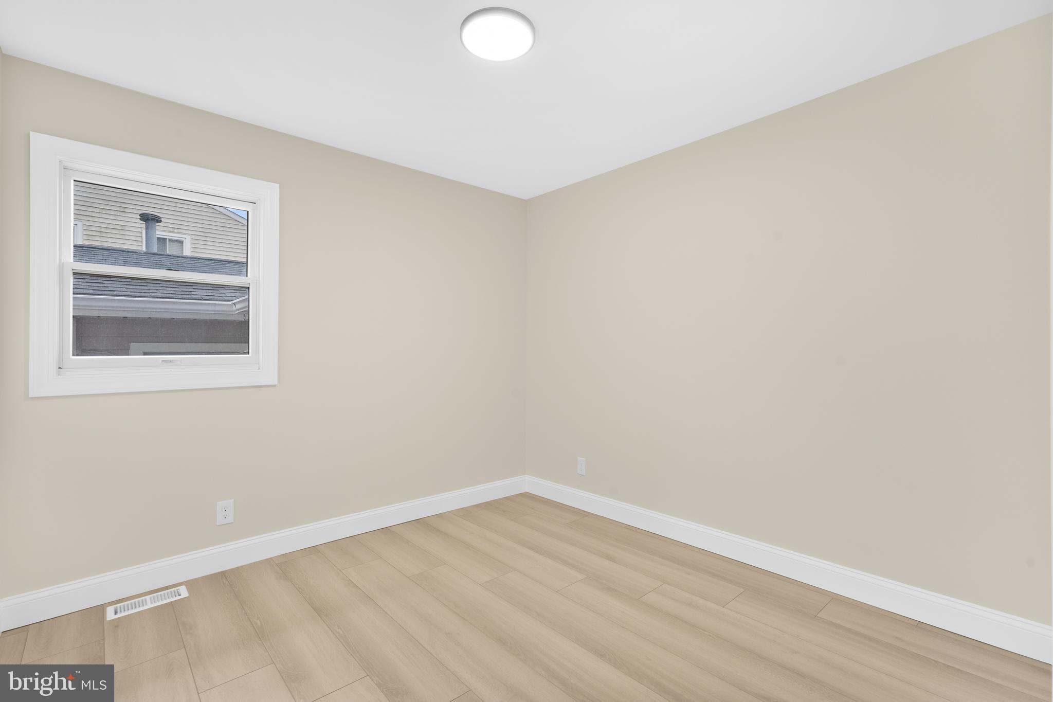120 Canterbury Road Mount Laurel, NJ 08054 - Photo 21 of 46 a view of an empty room with wooden floor and a window