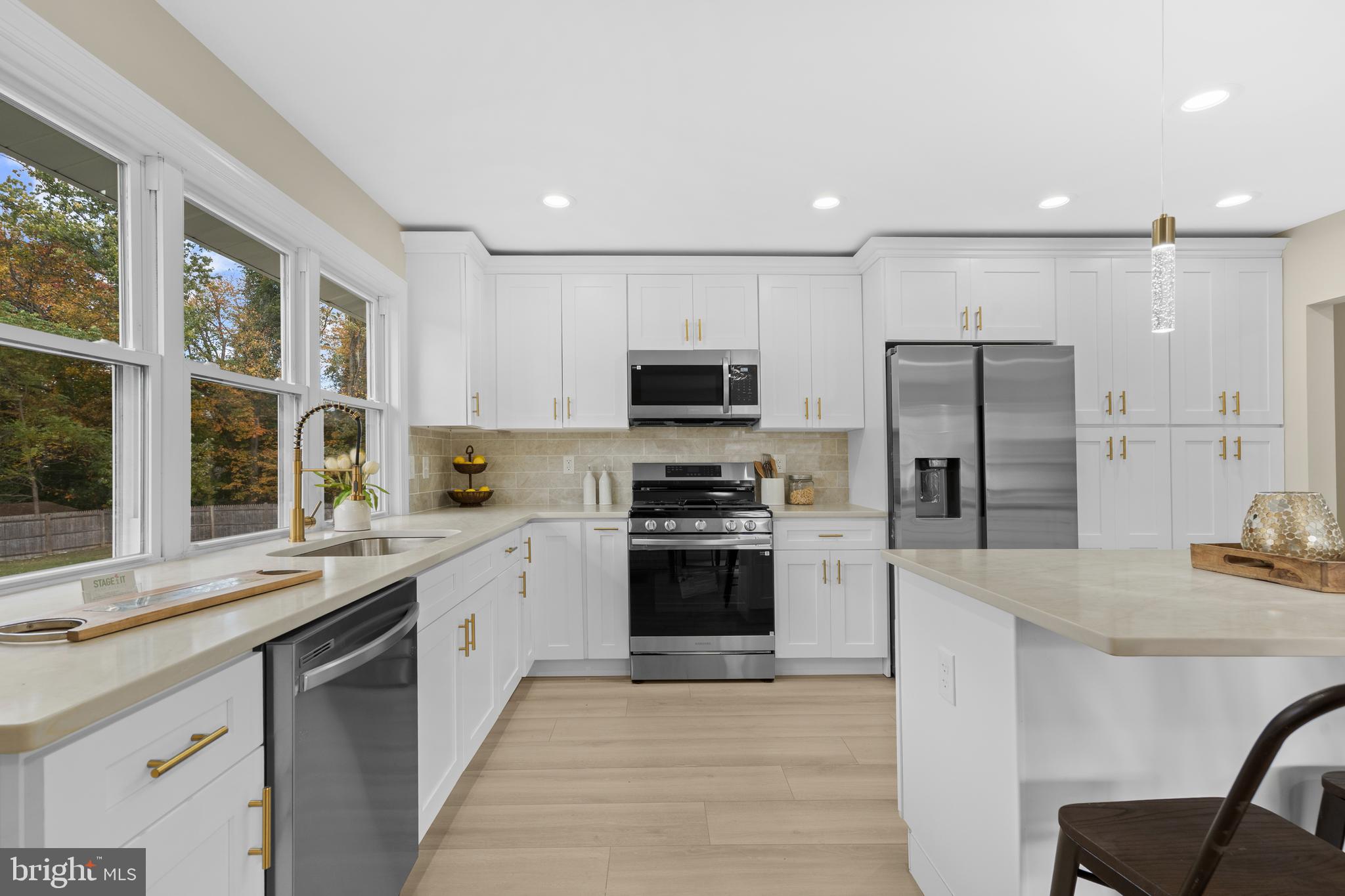 120 Canterbury Road Mount Laurel, NJ 08054 - Photo 6 of 46 a large kitchen with stainless steel appliances granite countertop a stove and a sink