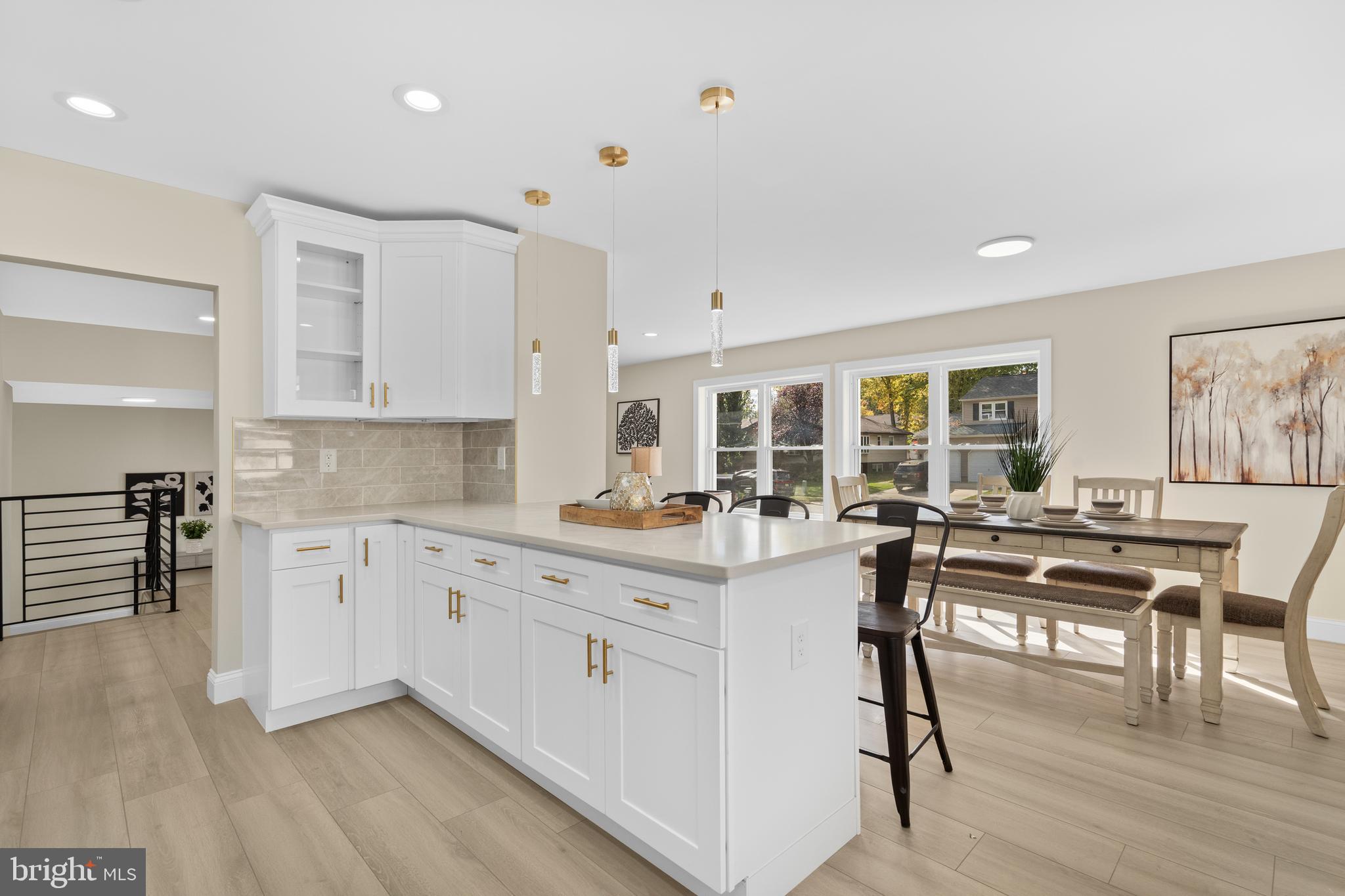 120 Canterbury Road Mount Laurel, NJ 08054 - Photo 7 of 46 a kitchen with white cabinets and chairs