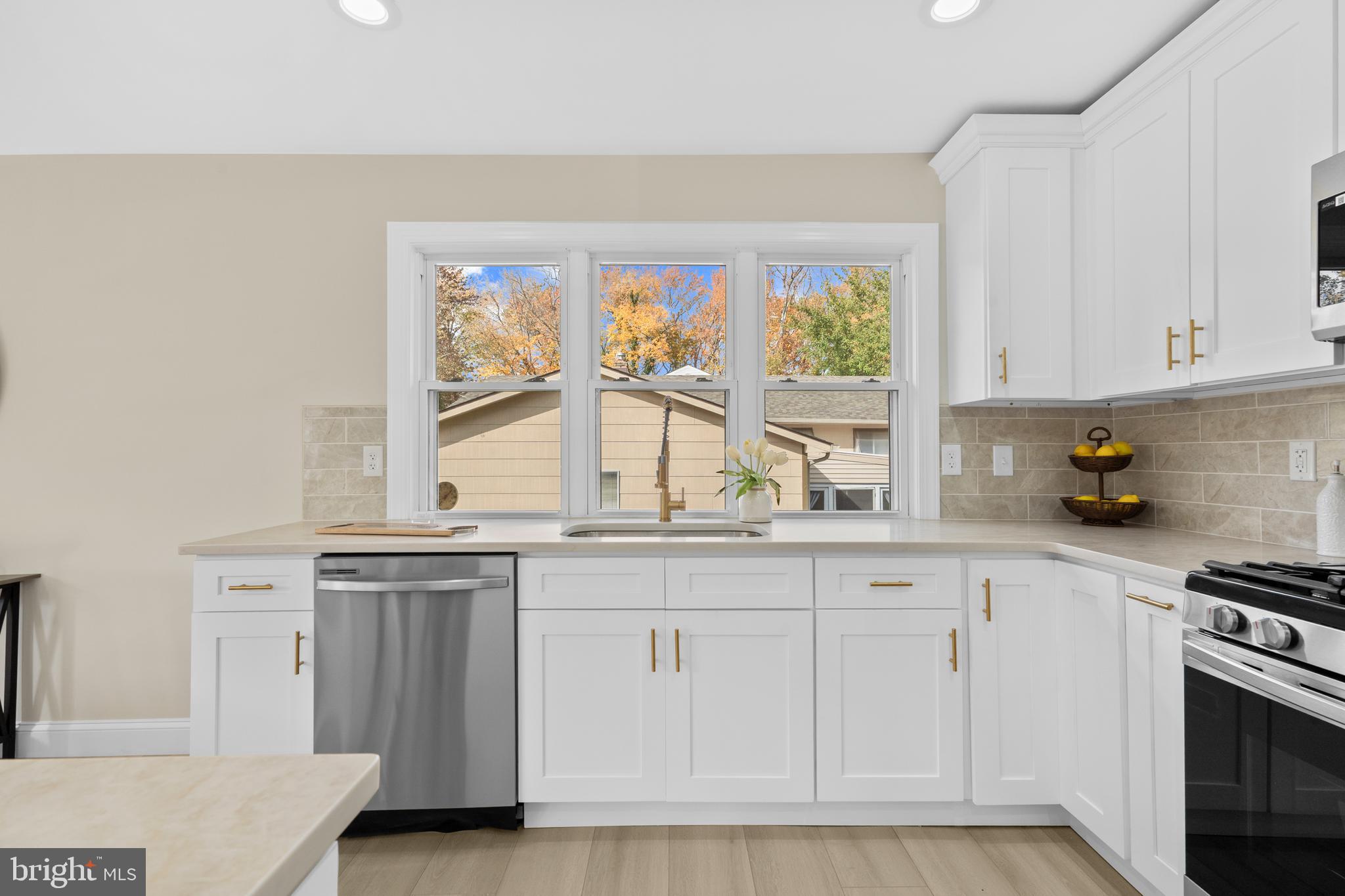 120 Canterbury Road Mount Laurel, NJ 08054 - Photo 8 of 46 a kitchen with white cabinets and window
