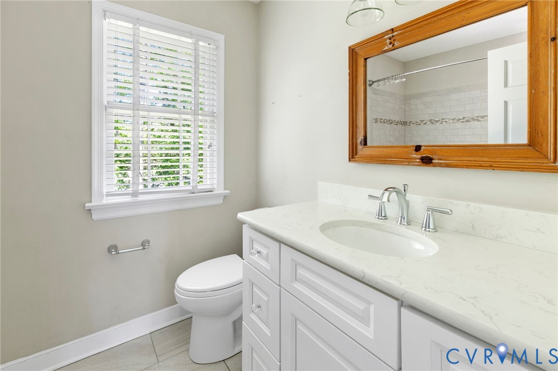 11520 Ivywood Road Chester, VA 23831 - Photo 28 of 35 Hall bathroom with another tiled tub shower.