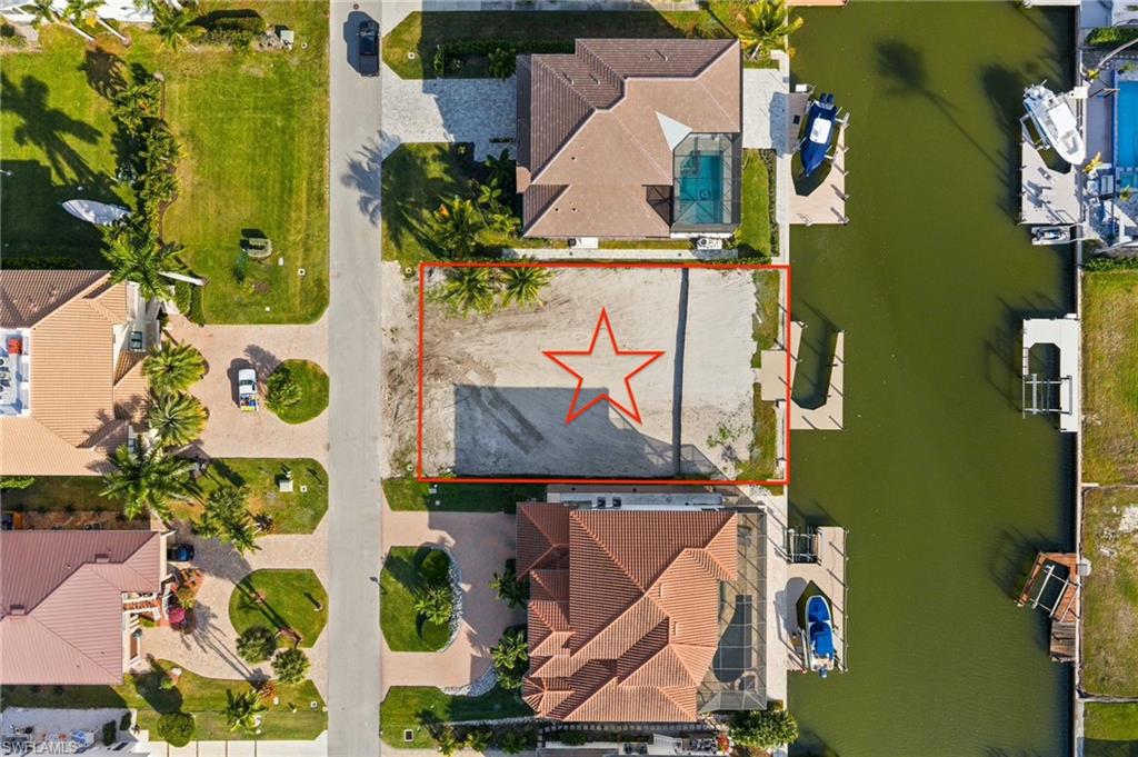 418 Seagull Avenue Naples, FL 34108 - Photo 11 of 36 an aerial view of residential houses with outdoor space
