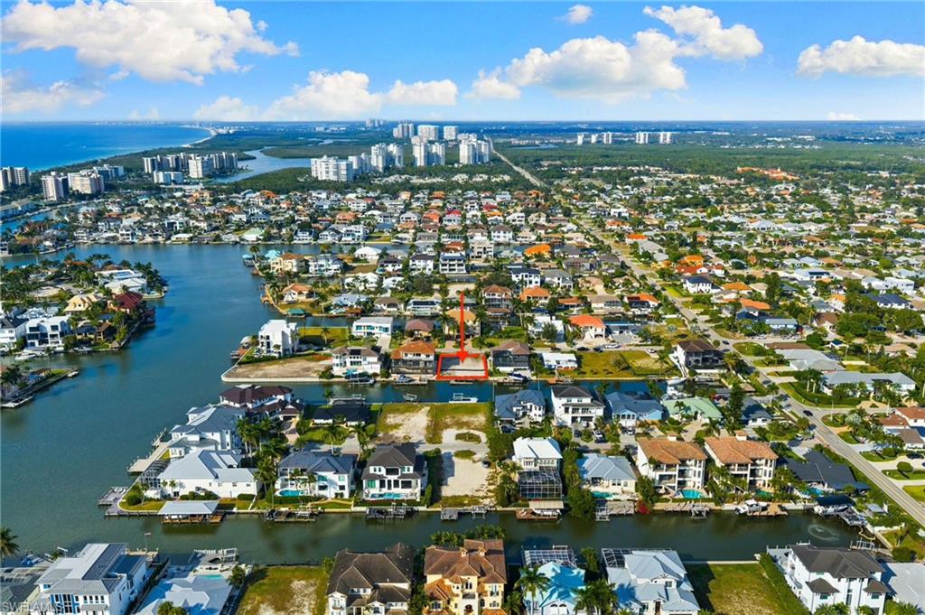 418 Seagull Avenue Naples, FL 34108 - Photo 12 of 36 a view of a lake with a mountain view