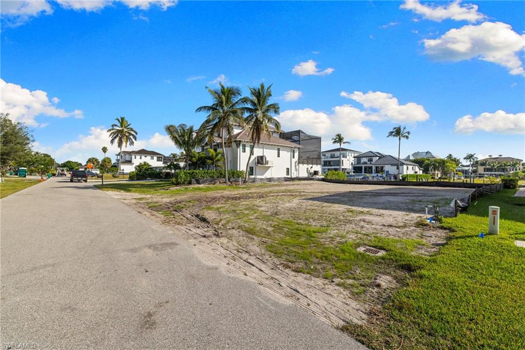 418 Seagull Avenue Naples, FL 34108 - Photo 18 of 36 a front view of a house with a lake view