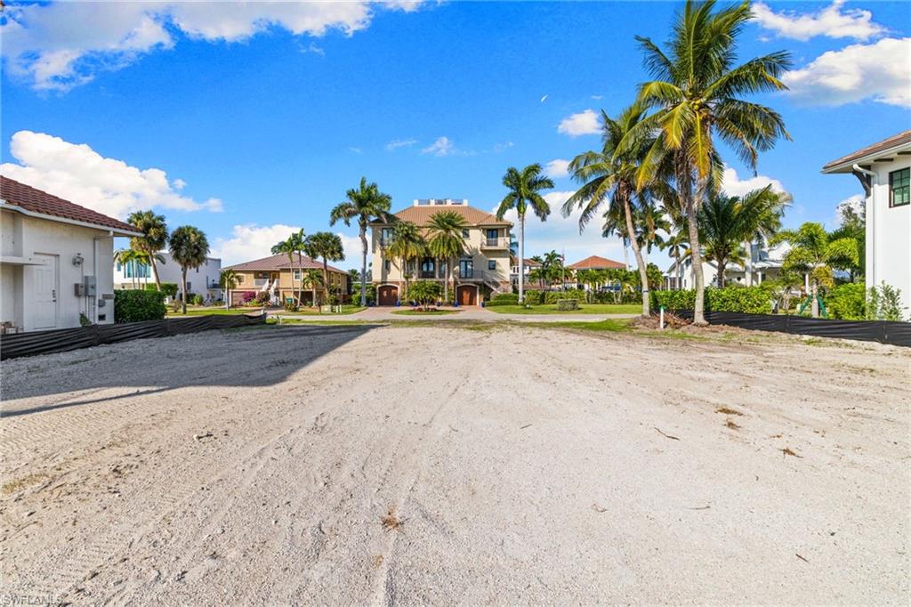 418 Seagull Avenue Naples, FL 34108 - Photo 20 of 36 a view of road with houses
