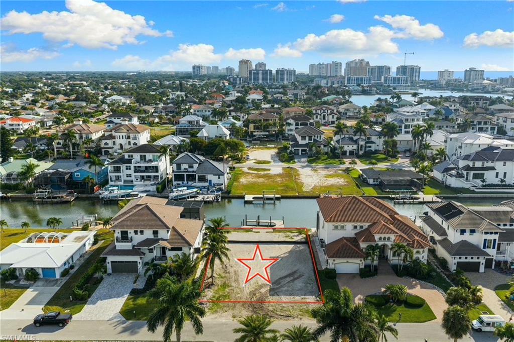 418 Seagull Avenue Naples, FL 34108 - Photo 4 of 36 a view of a city with tall buildings