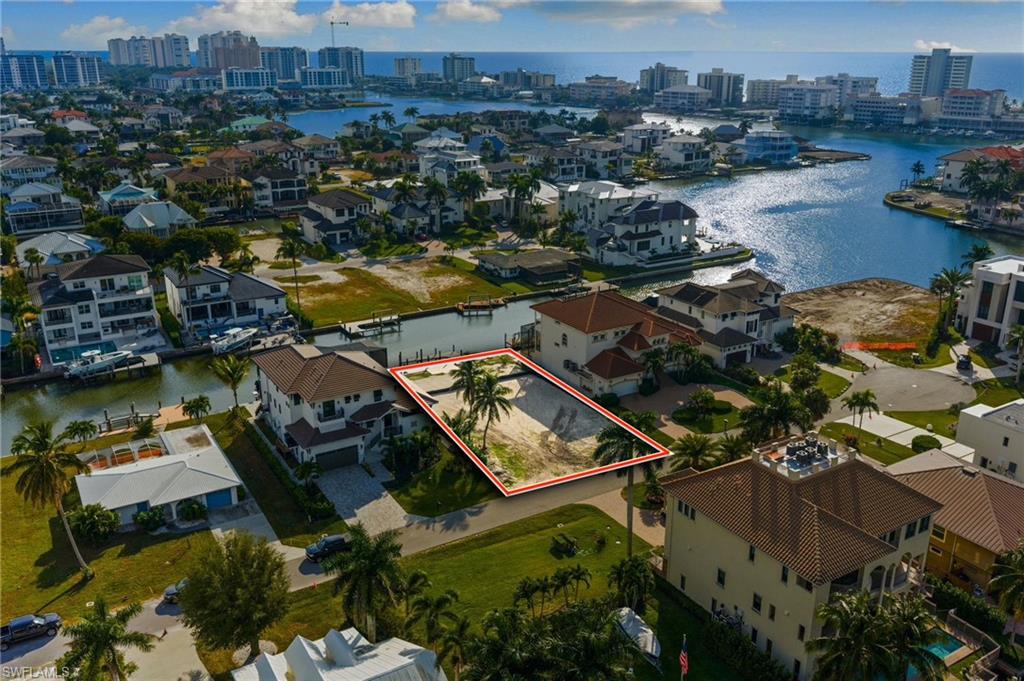 418 Seagull Avenue Naples, FL 34108 - Photo 7 of 36 an aerial view of residential houses with outdoor space