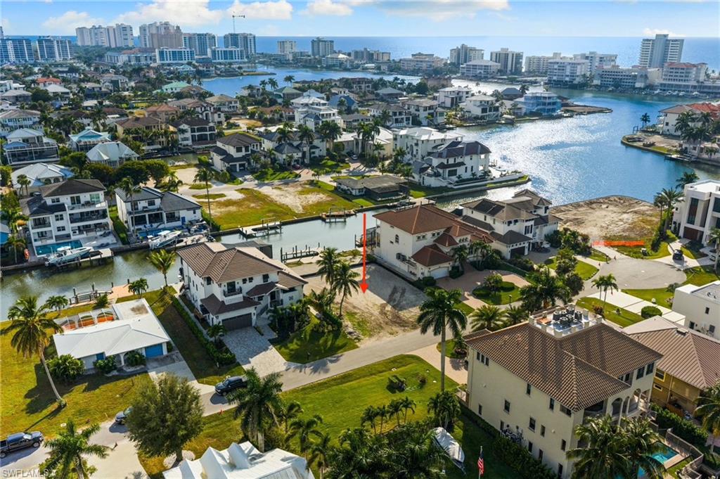 418 Seagull Avenue Naples, FL 34108 - Photo 8 of 36 an aerial view of residential houses with outdoor space