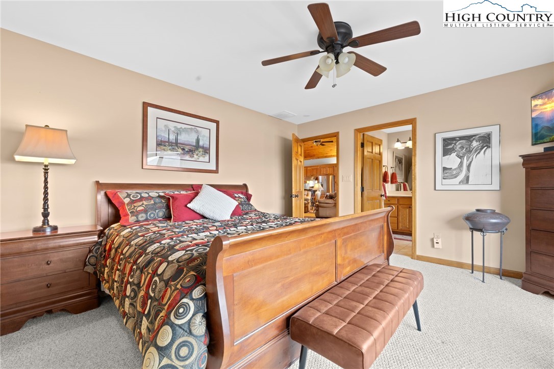 295 Supreme Golden Road Banner Elk, NC 28604 - Photo 16 of 40 a bed room with a bed and a couch