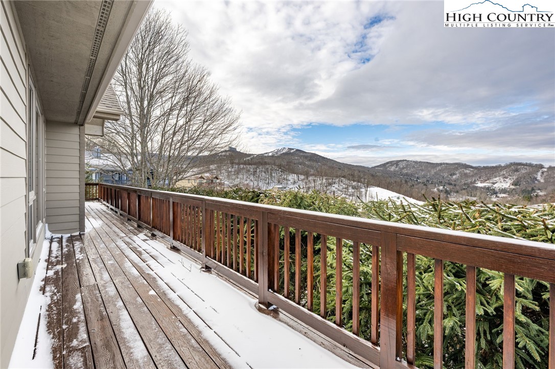 295 Supreme Golden Road Banner Elk, NC 28604 - Photo 31 of 40 a balcony with wooden floor and city view